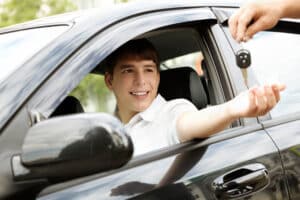 teen driver getting car keys from parent